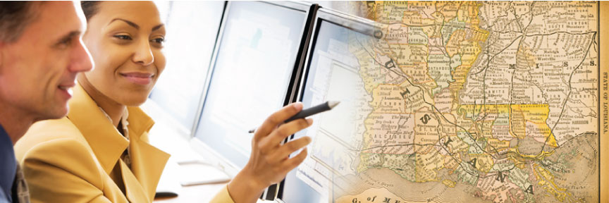 Woman pointing to a computer screen overlayed with a map of Louisiana